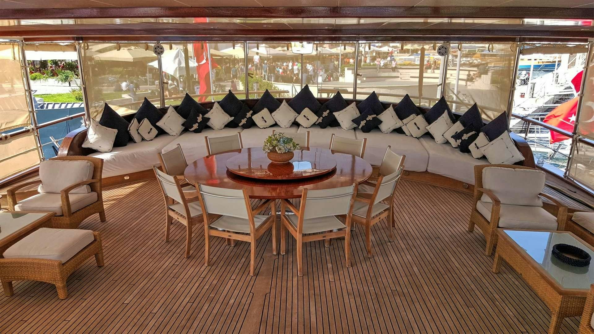 a room with a table and chairs aboard SEA DREAM Yacht for Charter