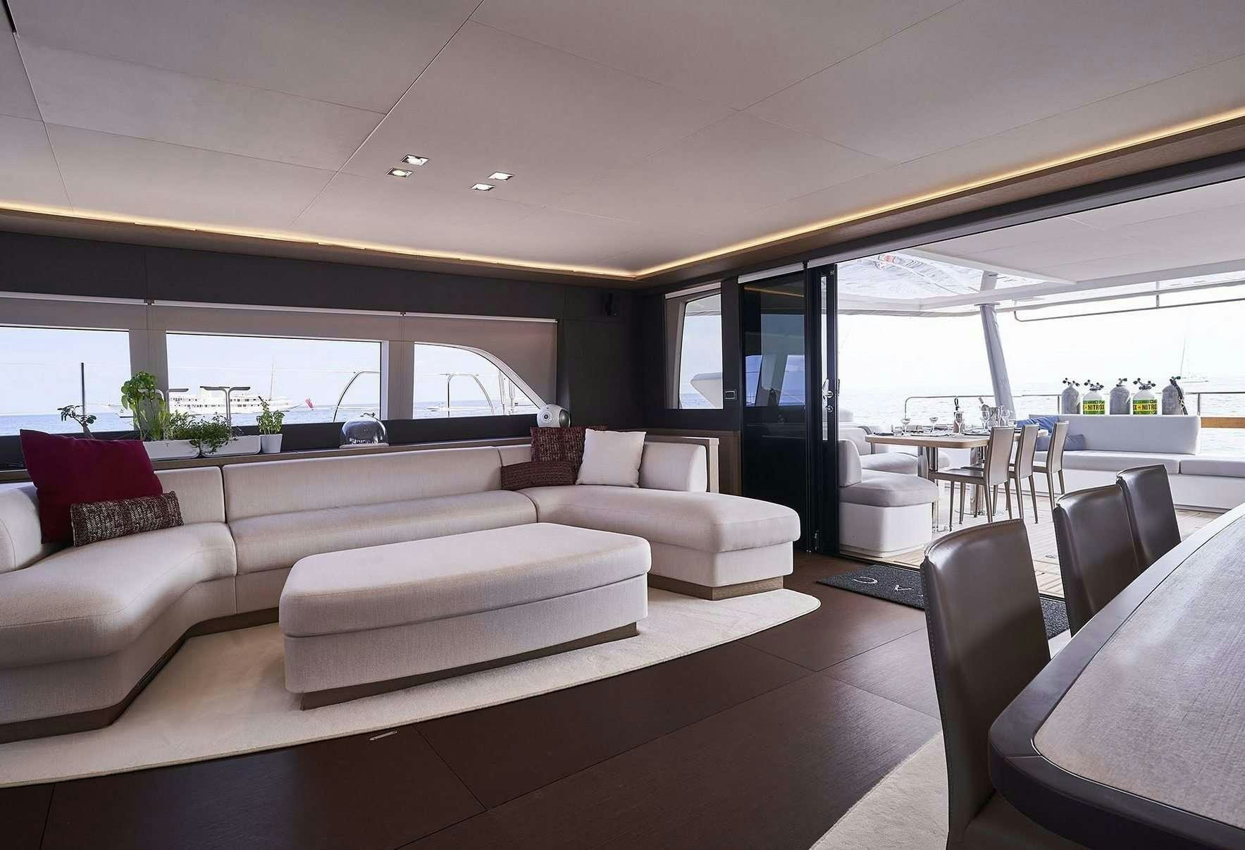 a living room with a large window aboard BABAC Yacht for Charter