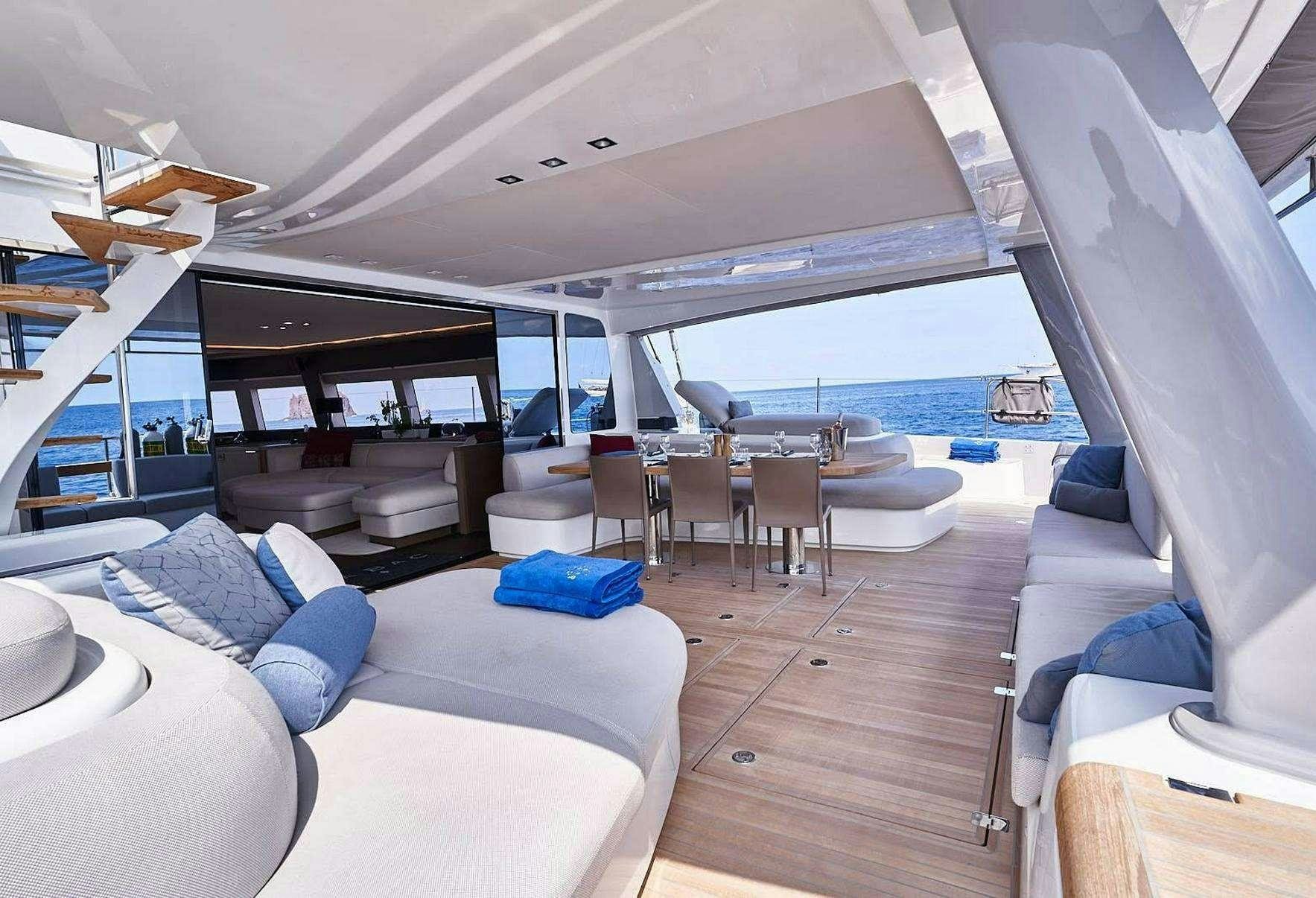 a room with a view of the water and the deck aboard BABAC Yacht for Charter