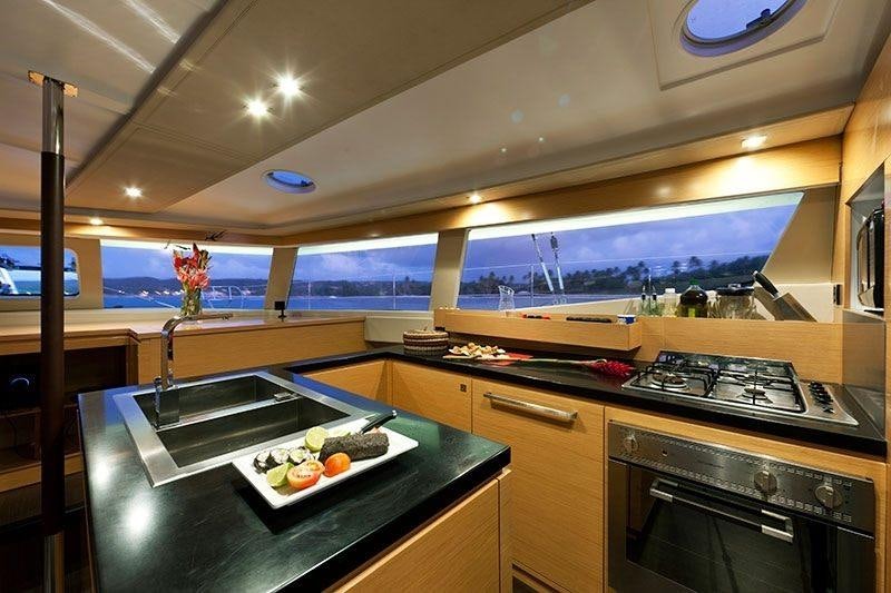 a kitchen with a large glass window aboard ALIVE Yacht for Charter