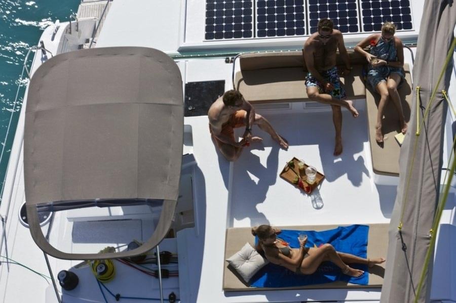 a group of people jumping in a swimming pool aboard ALIVE Yacht for Charter
