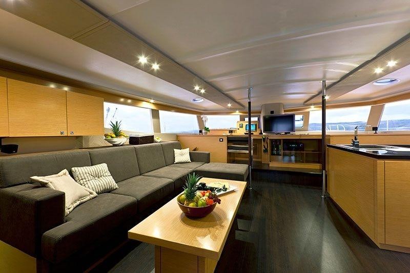 a living room with a couch and a table aboard ALIVE Yacht for Charter