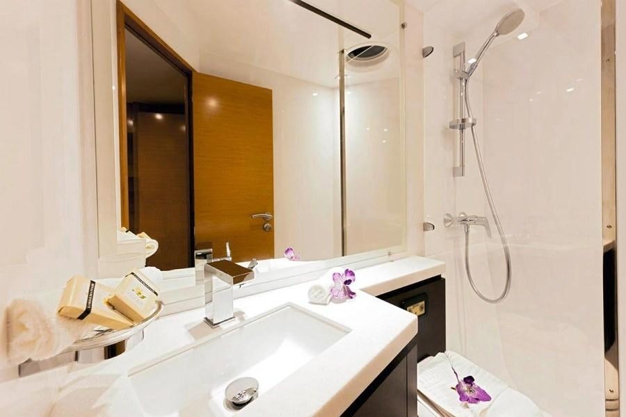 a bathroom with a large mirror aboard ALIVE Yacht for Charter