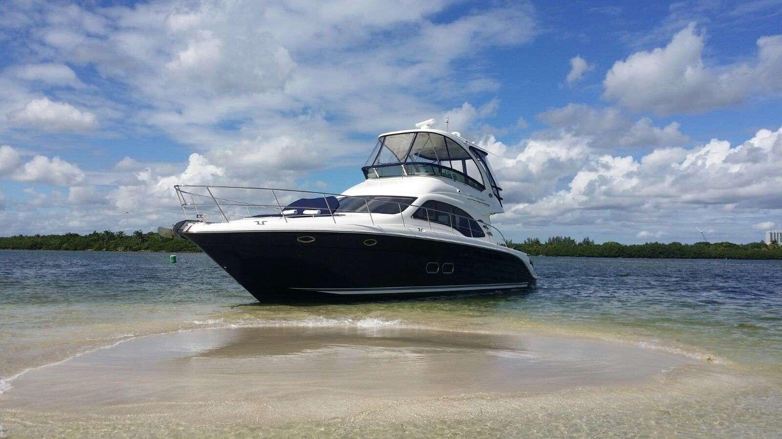 a boat on the beach aboard FUN CLUB Yacht for Charter