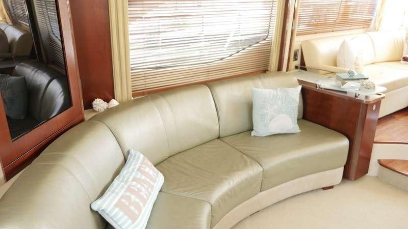 a couch with pillows aboard FUN CLUB Yacht for Charter