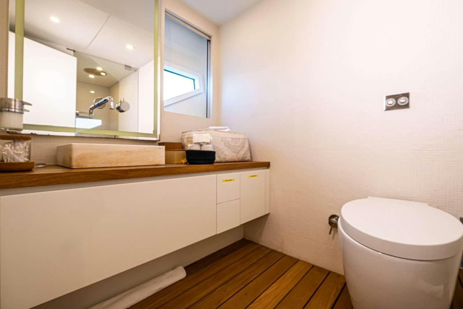 a bathroom with a toilet and a sink aboard HARUN Yacht for Charter