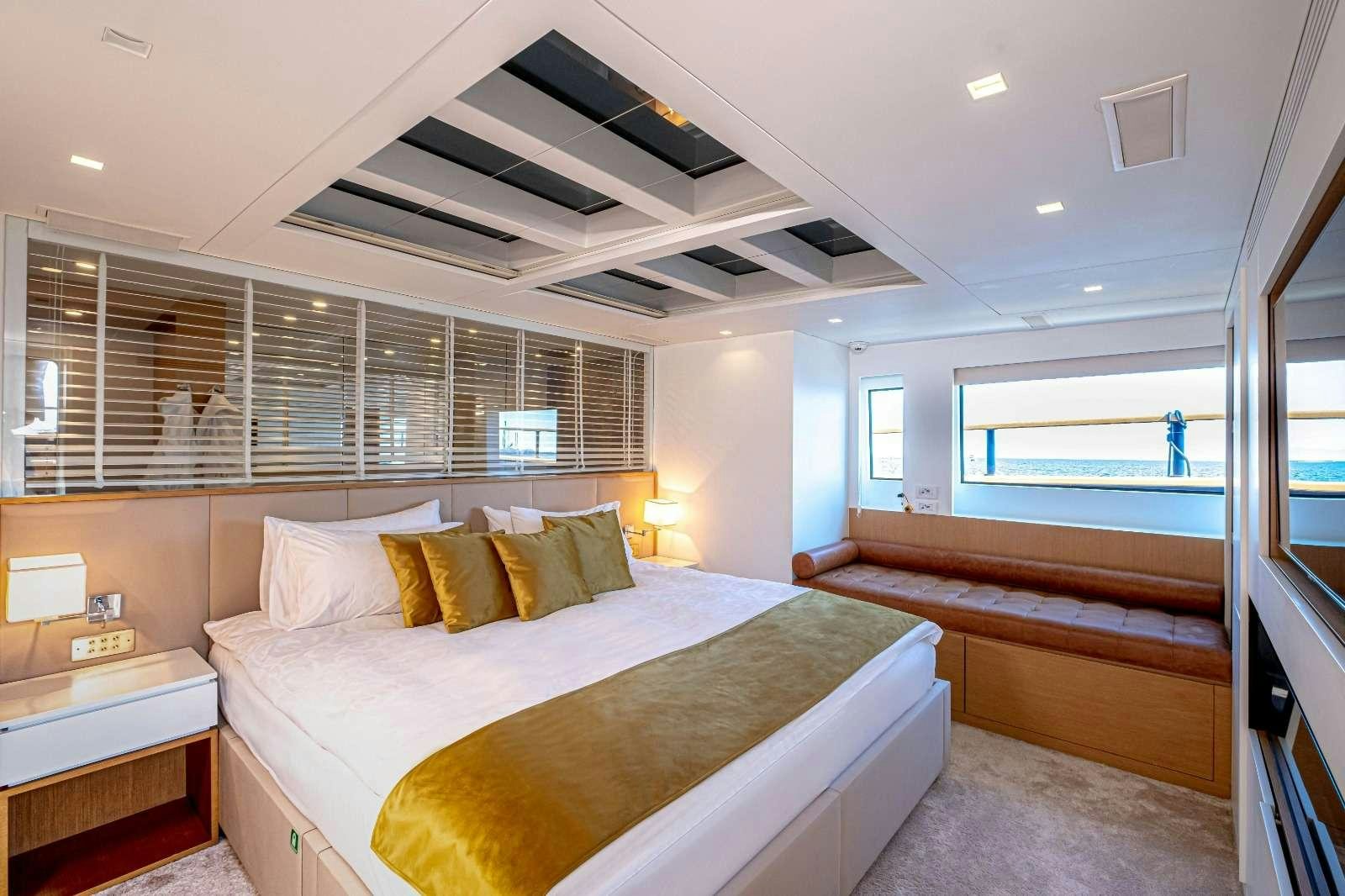 a bedroom with a large bed aboard HARUN Yacht for Charter