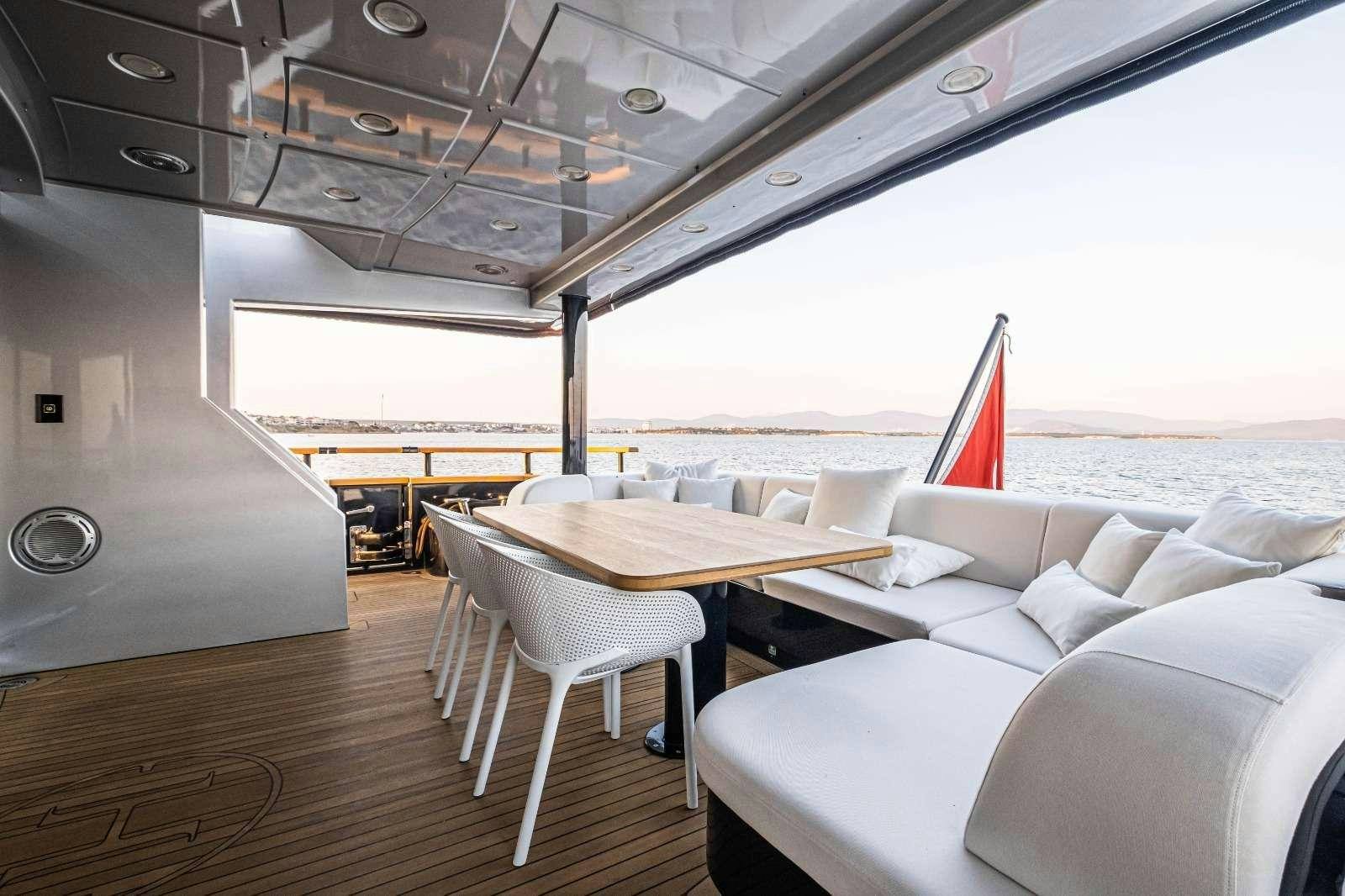 a room with a table and chairs aboard HARUN Yacht for Charter