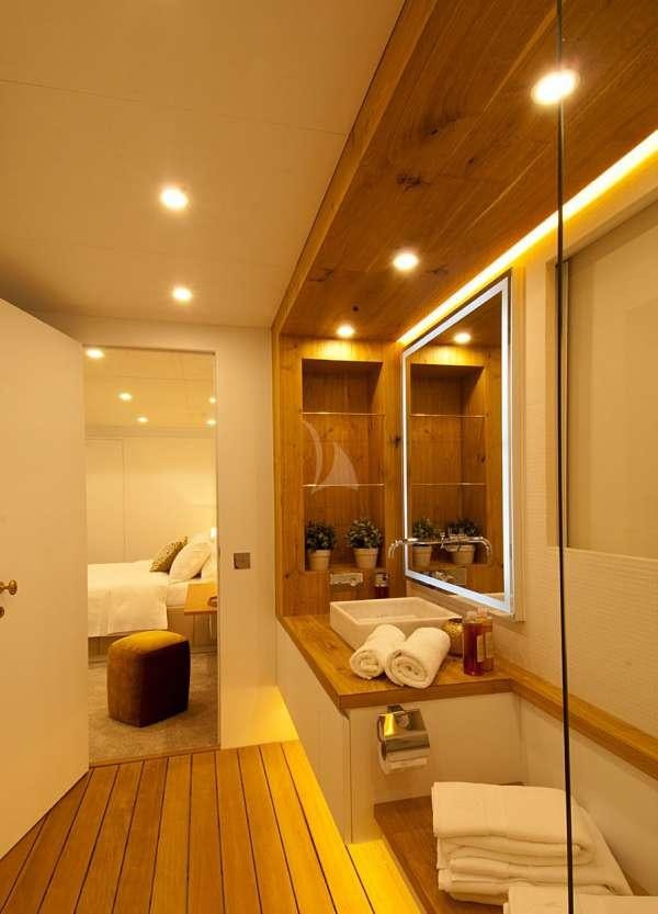 a bathroom with a large mirror aboard HARUN Yacht for Charter