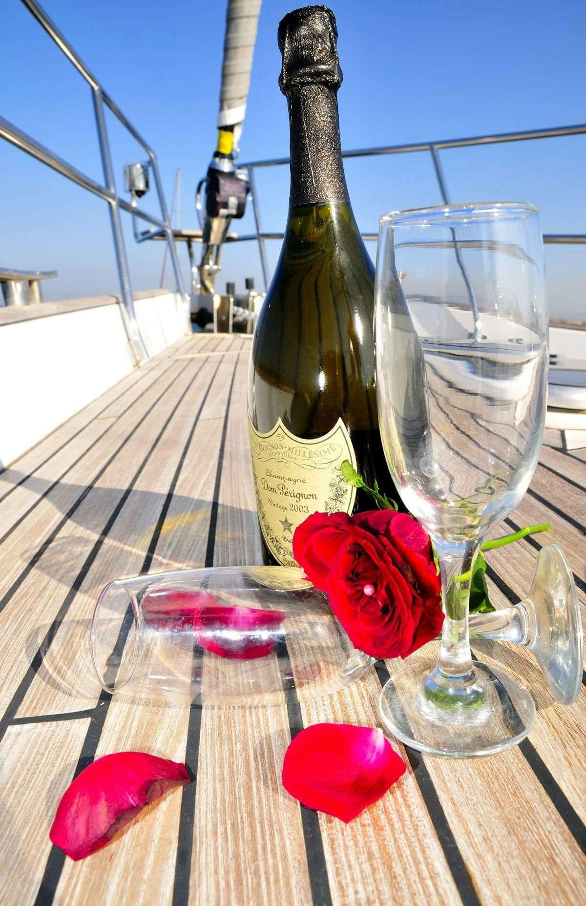 a wine bottle and glasses on a table aboard SEA STAR Yacht for Charter