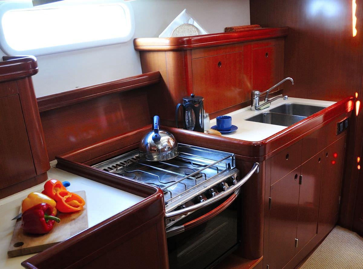 a kitchen with a stove and sink aboard SEA STAR Yacht for Charter