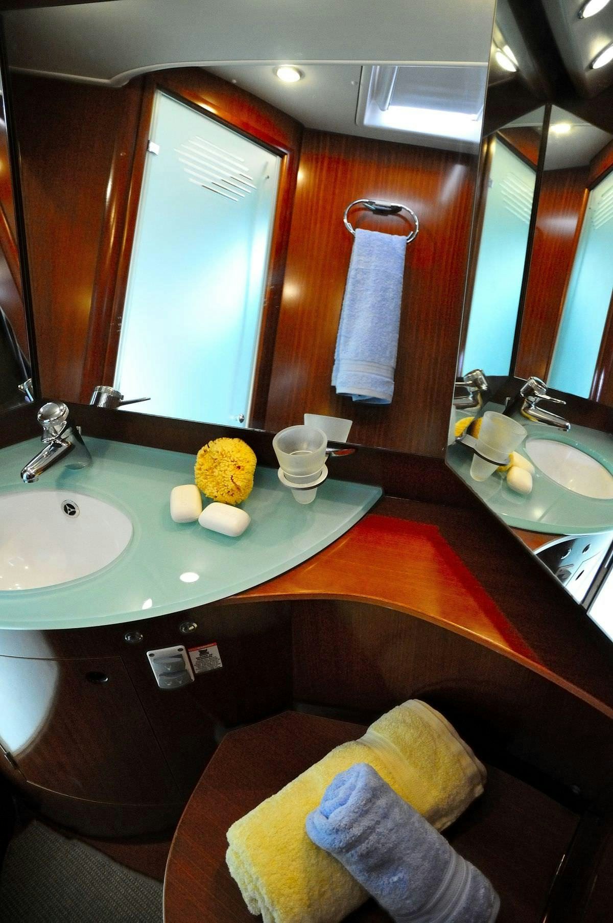 a bathroom with a large mirror aboard SEA STAR Yacht for Charter