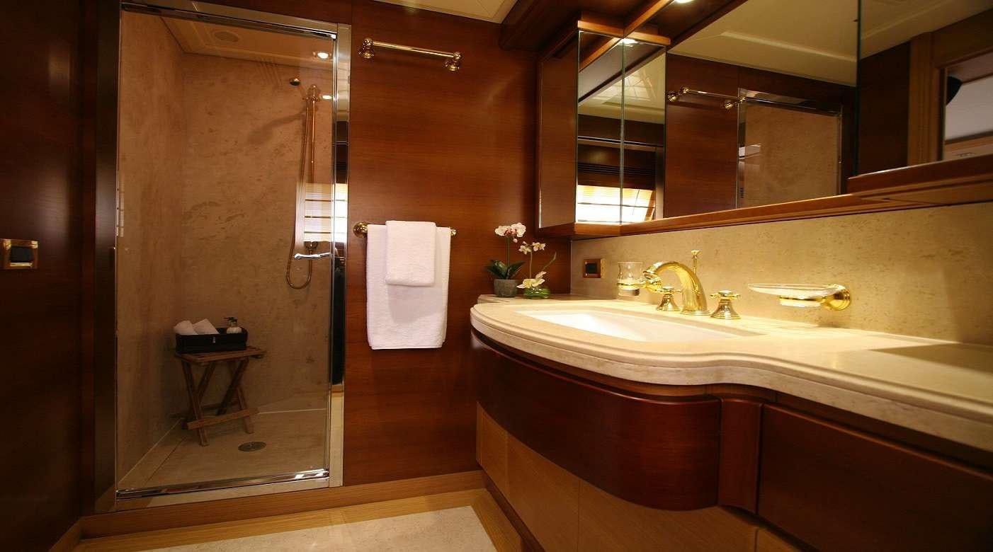 a bathroom with a sink and a shower aboard SEA LION II Yacht for Charter