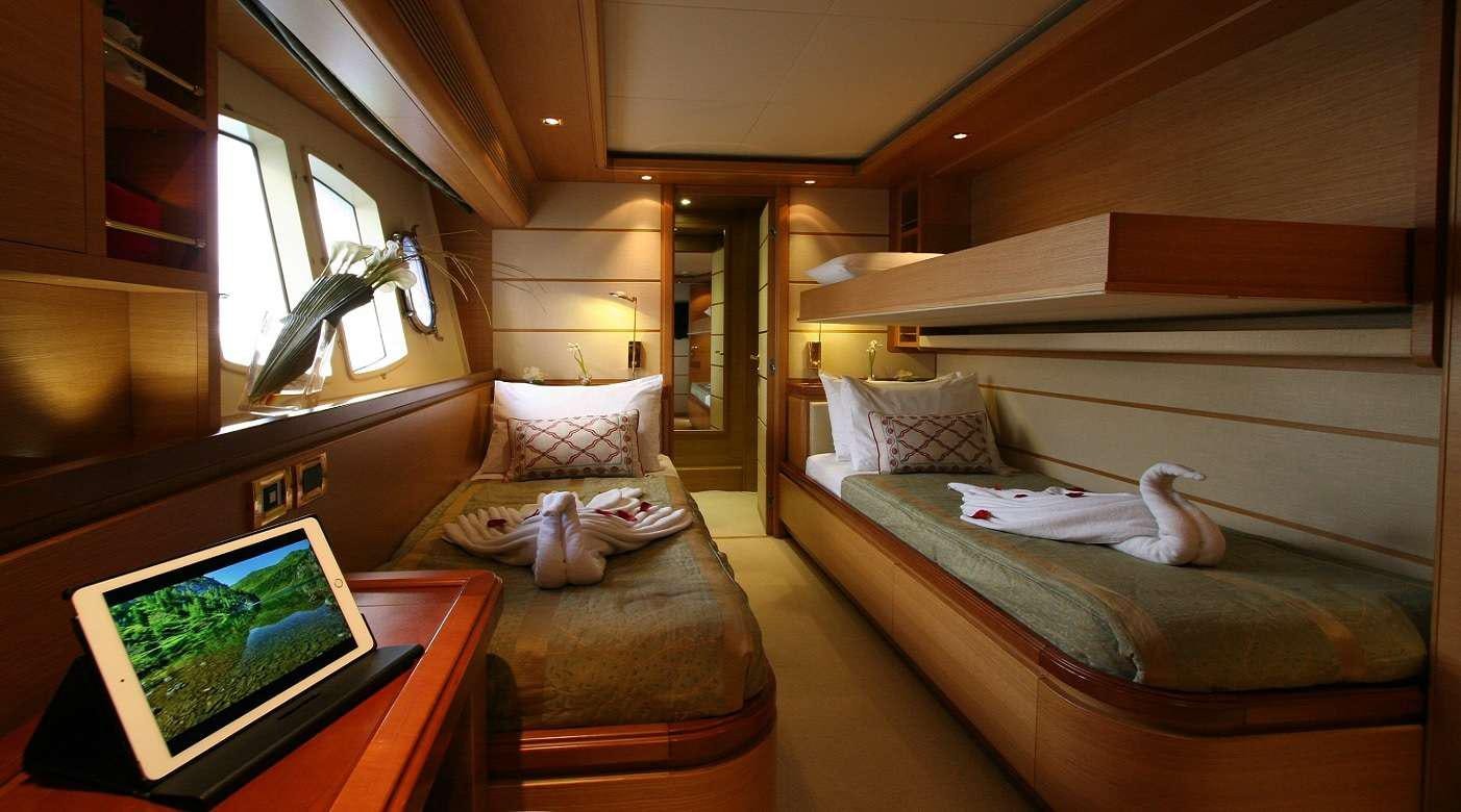 a room with a bed and a laptop on the bed aboard SEA LION II Yacht for Charter
