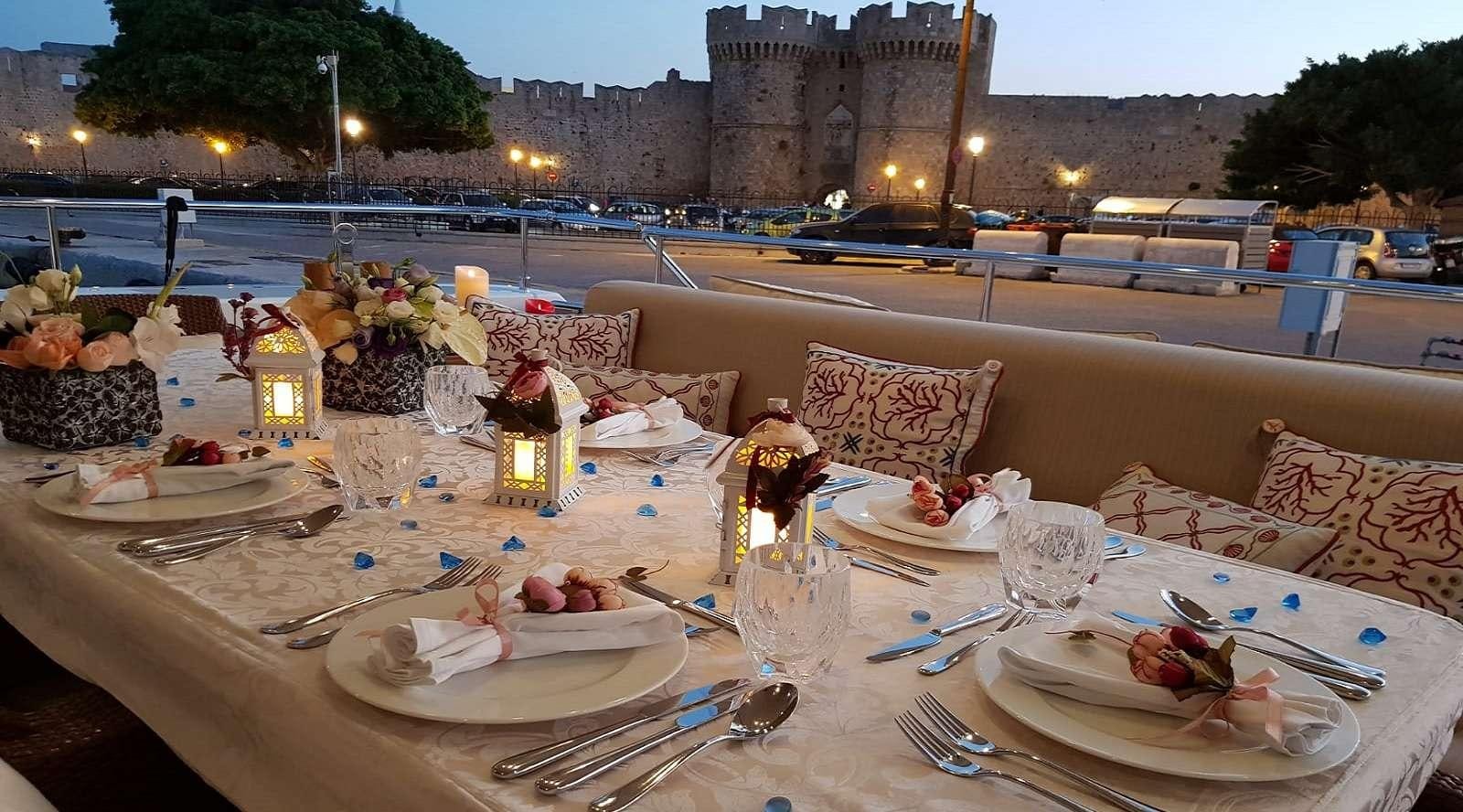 a table with plates and food on it aboard SEA LION II Yacht for Charter