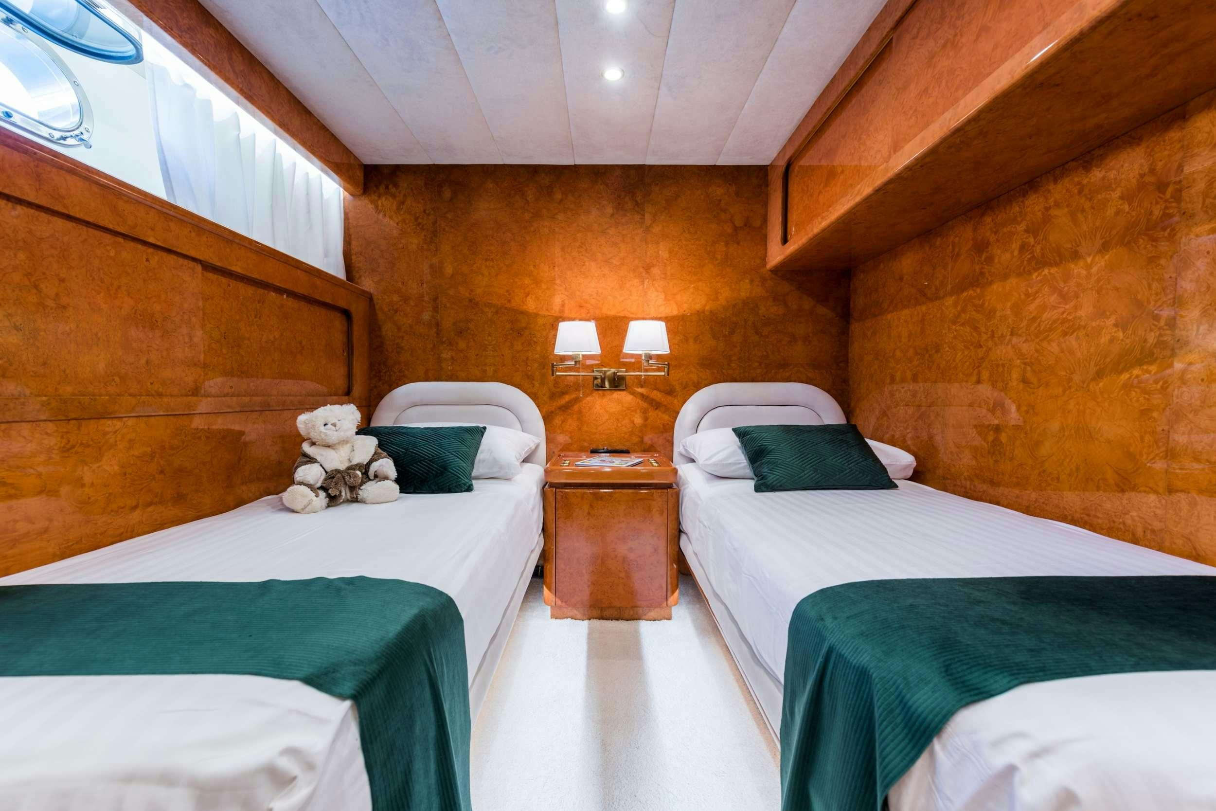 a couple of beds in a room aboard BORA BORA Yacht for Charter