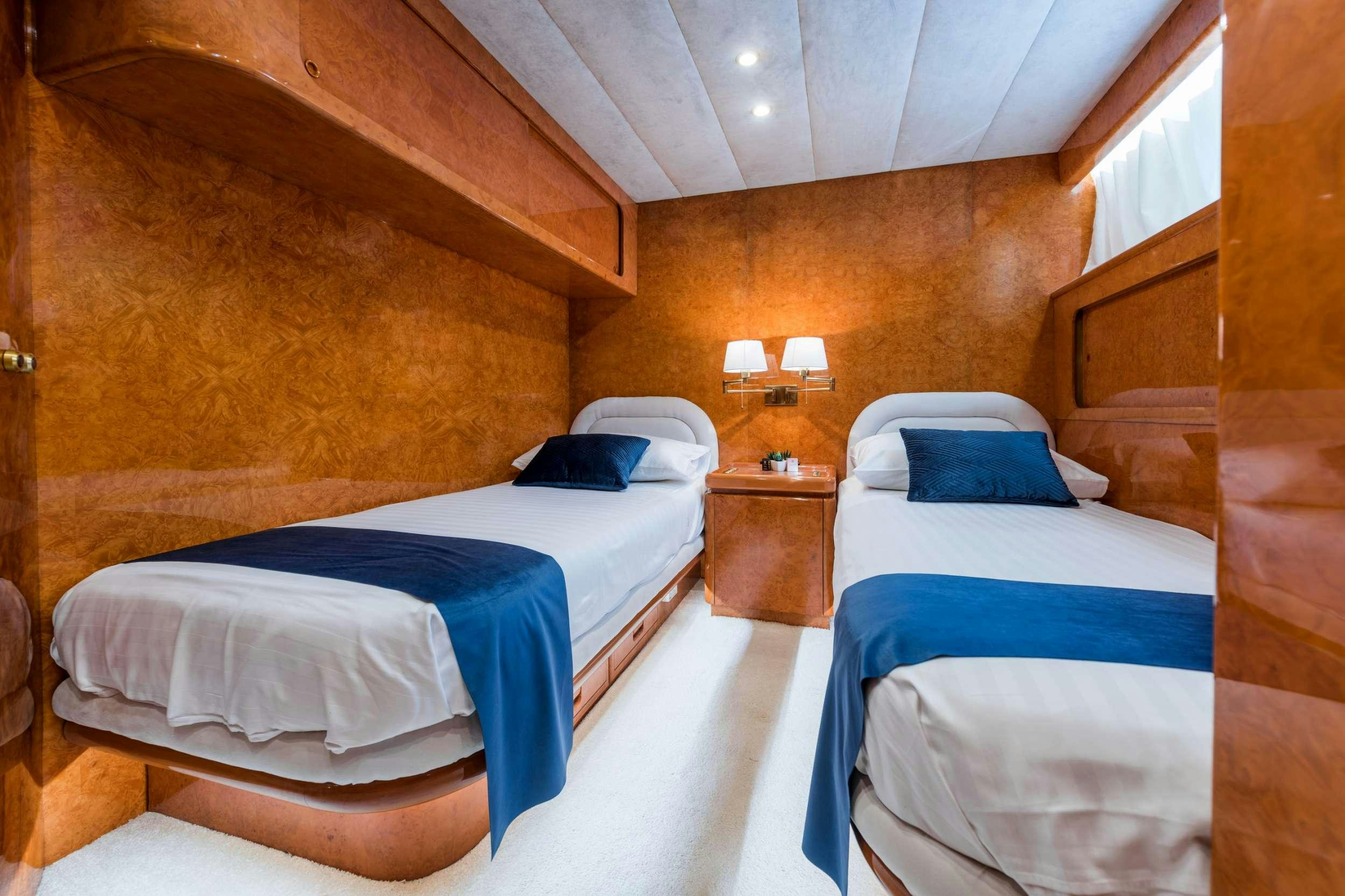 a room with two beds aboard BORA BORA Yacht for Charter