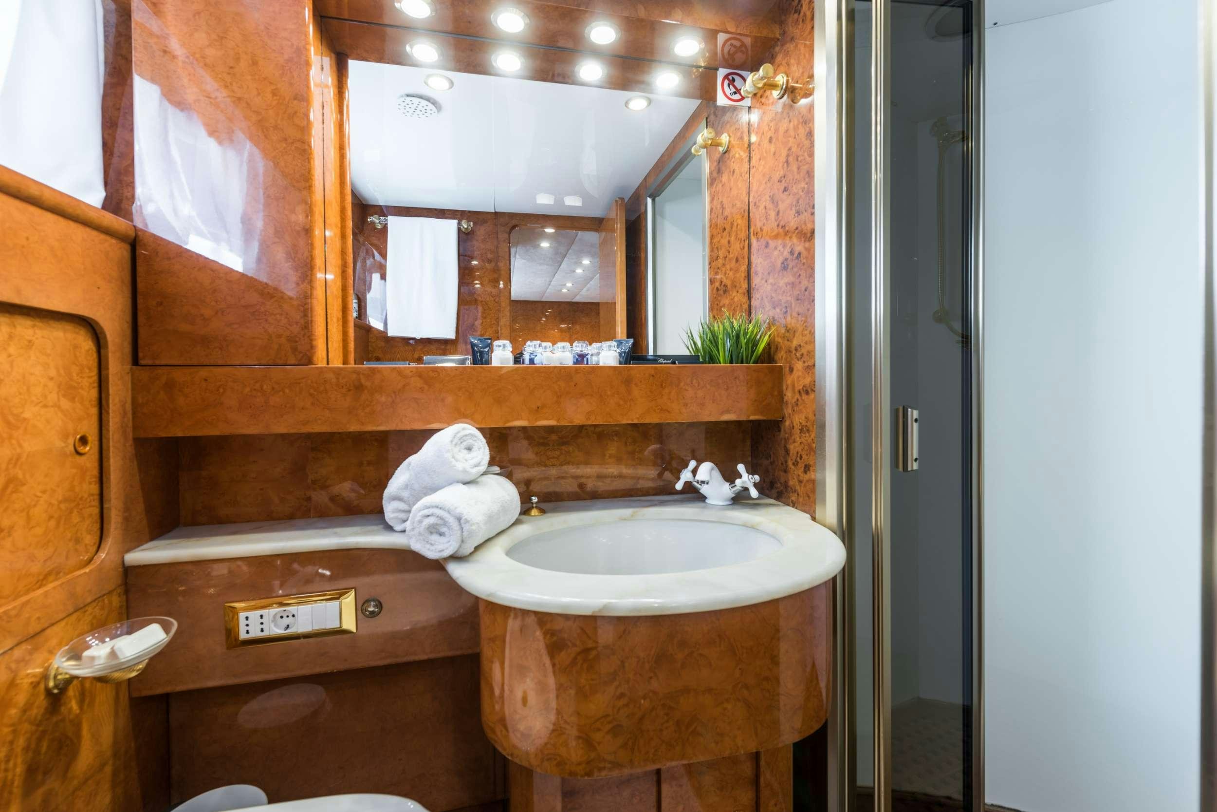 a bathroom with a sink and a mirror aboard BORA BORA Yacht for Charter