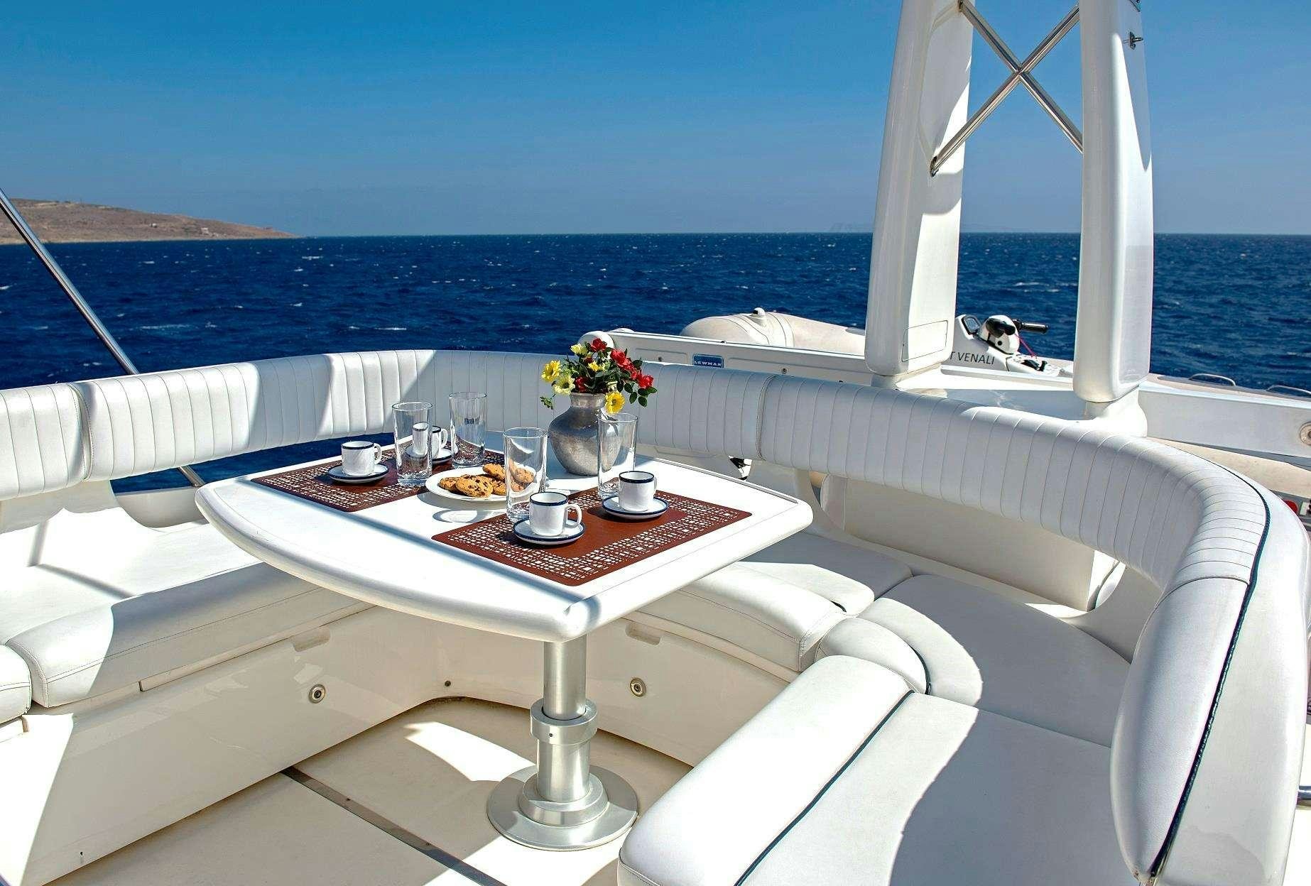 a table on a boat aboard VENALI Yacht for Charter