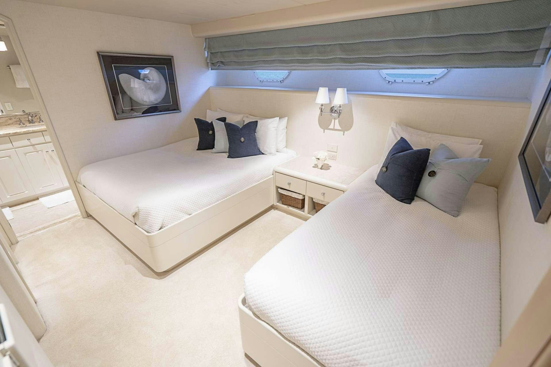 a room with two beds aboard CHERISH Yacht for Charter
