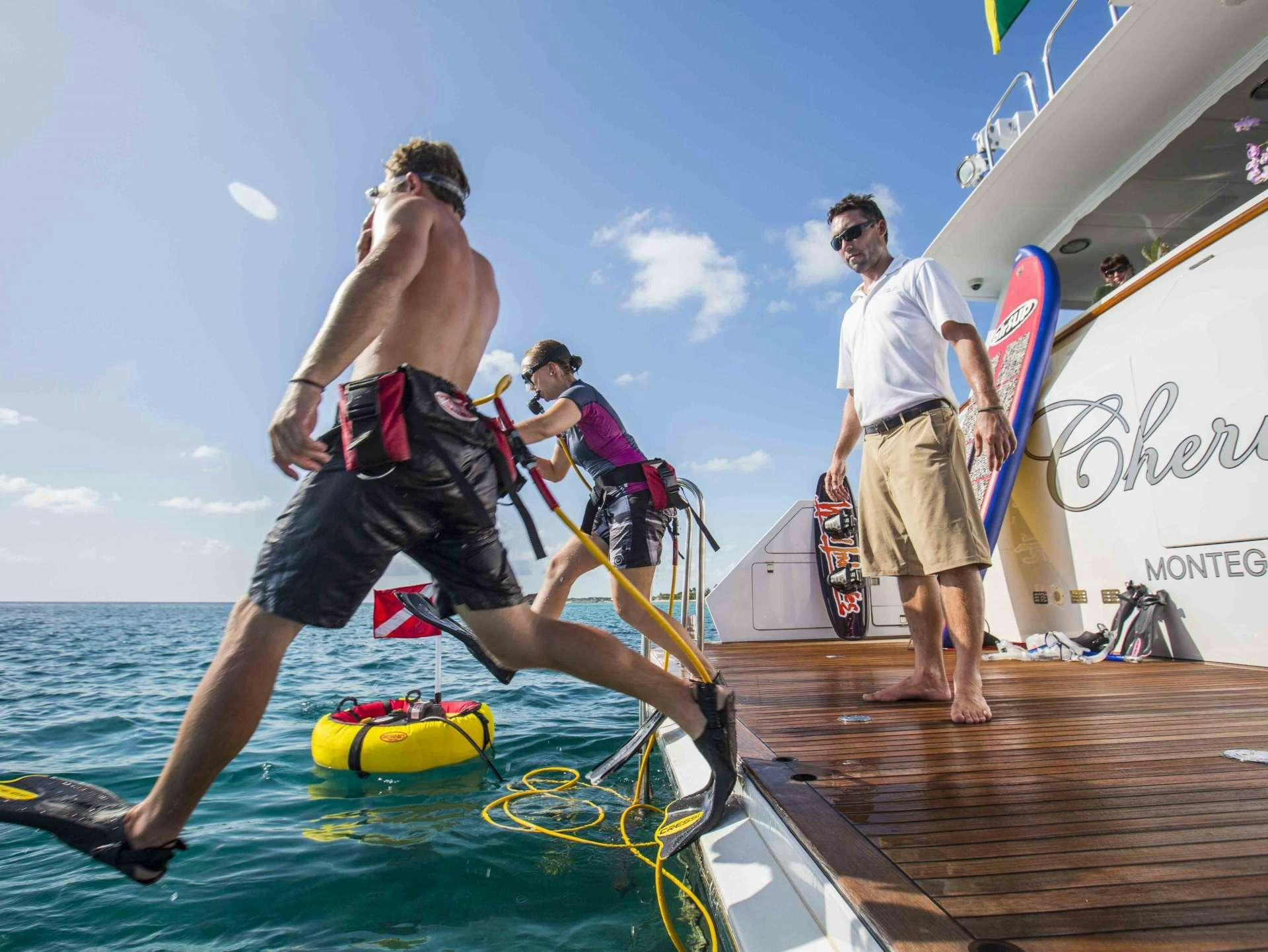 a group of people on a dock aboard CHERISH Yacht for Charter