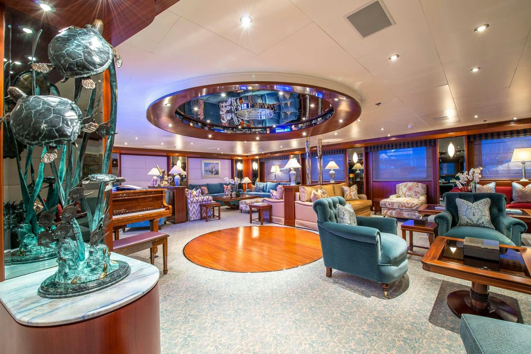 a large room with a large chandelier and a large chandelier aboard LAUREN L Yacht for Charter