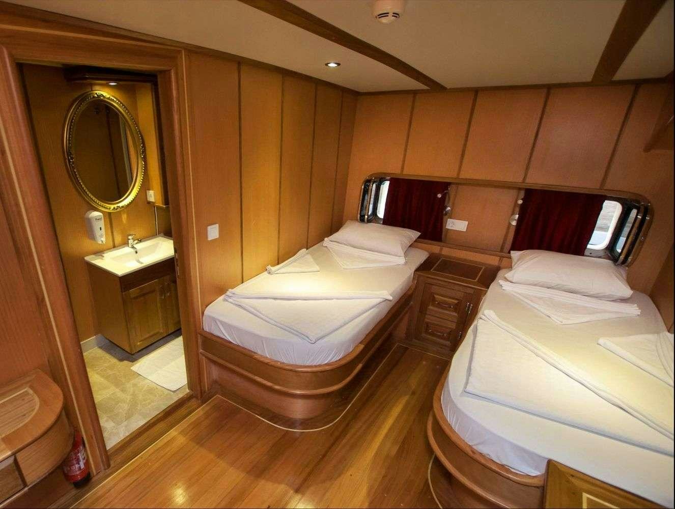 a room with two beds aboard TERSANE 8 Yacht for Charter