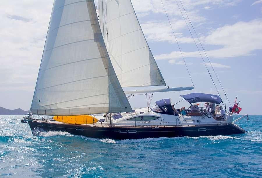 a boat sailing on the sea aboard SAYANG Yacht for Charter