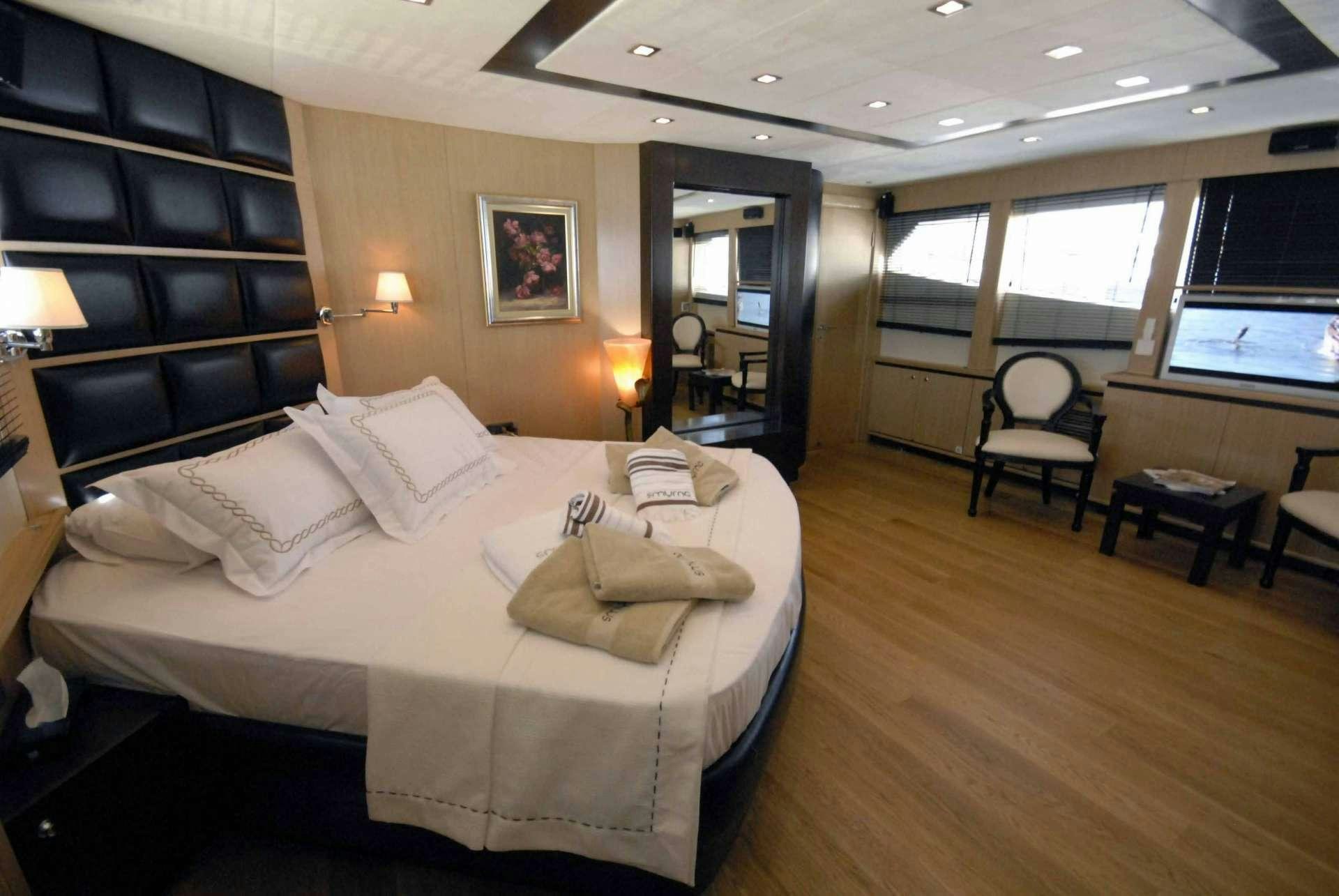a large bedroom with a large bed aboard SMYRNA Yacht for Charter