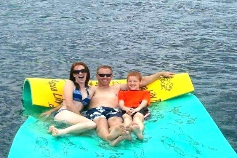 a group of people on a raft aboard CHAMPAGNE Yacht for Charter