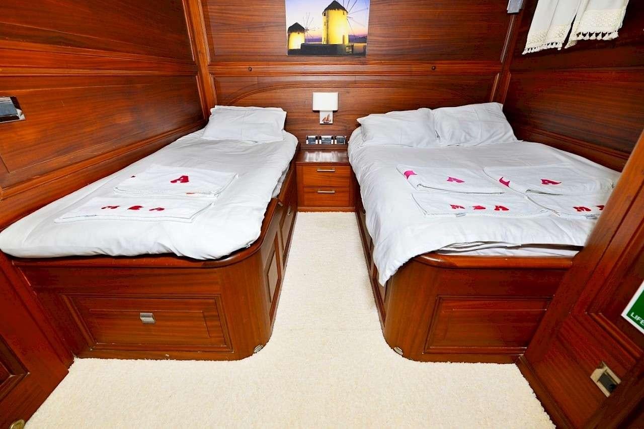 a couple of beds in a room aboard MIA 1 Yacht for Charter