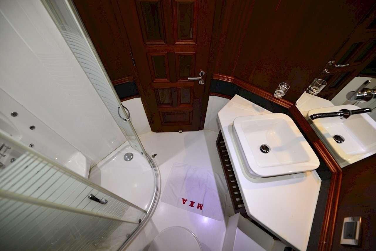 a bathroom with a sink and a bathtub aboard MIA 1 Yacht for Charter