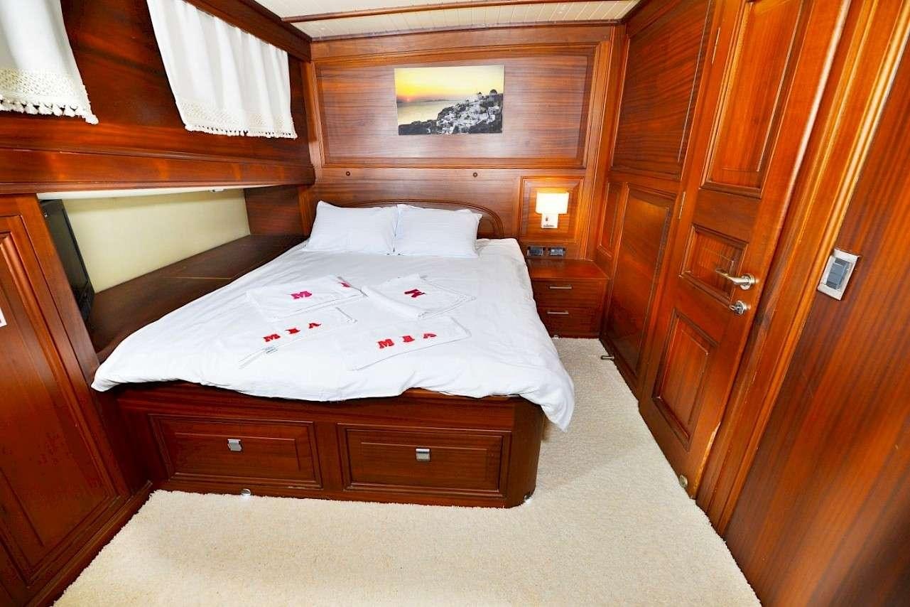 a bed in a room aboard MIA 1 Yacht for Charter