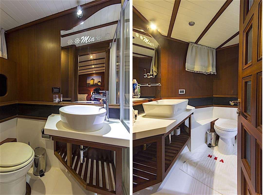 a bathroom with a large mirror aboard MIA 1 Yacht for Charter