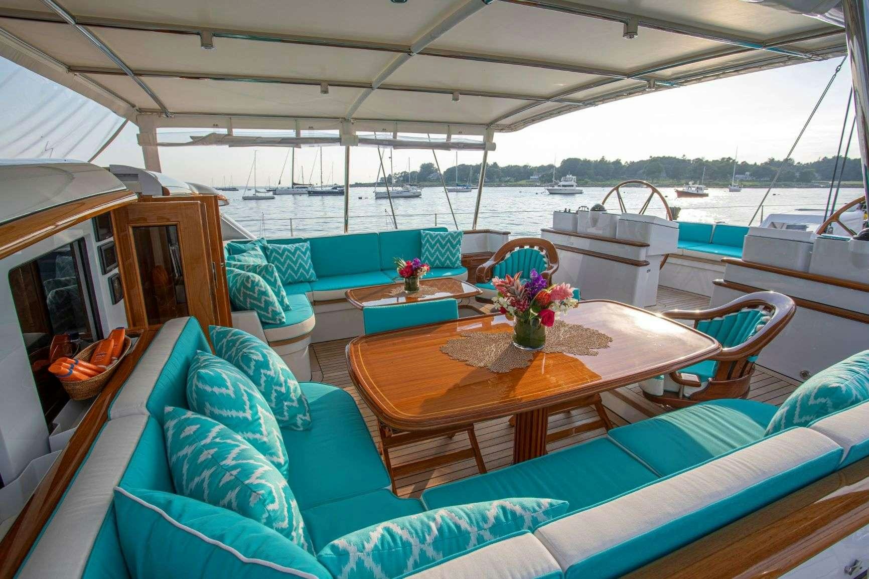 a boat with a table and chairs aboard WHISPER Yacht for Charter