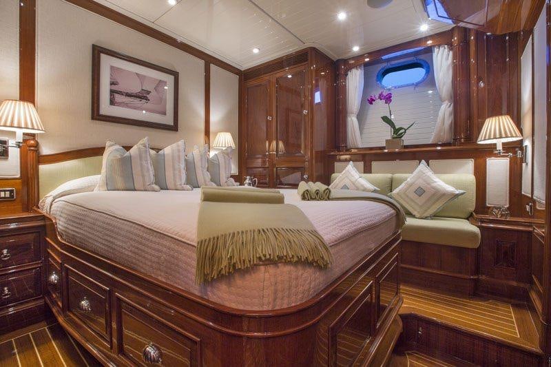 a large bed in a hotel room aboard WHISPER Yacht for Charter