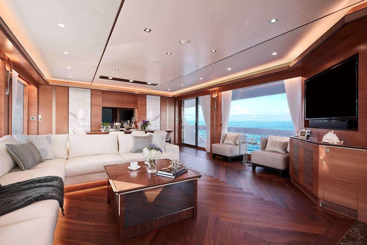 a living room with a large window aboard MIDNIGHT MOON Yacht for Charter
