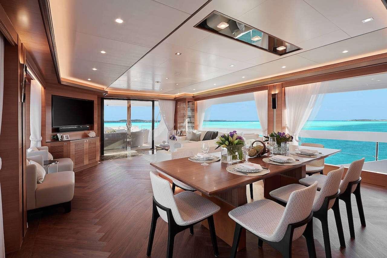 a dining table in a room aboard MIDNIGHT MOON Yacht for Charter