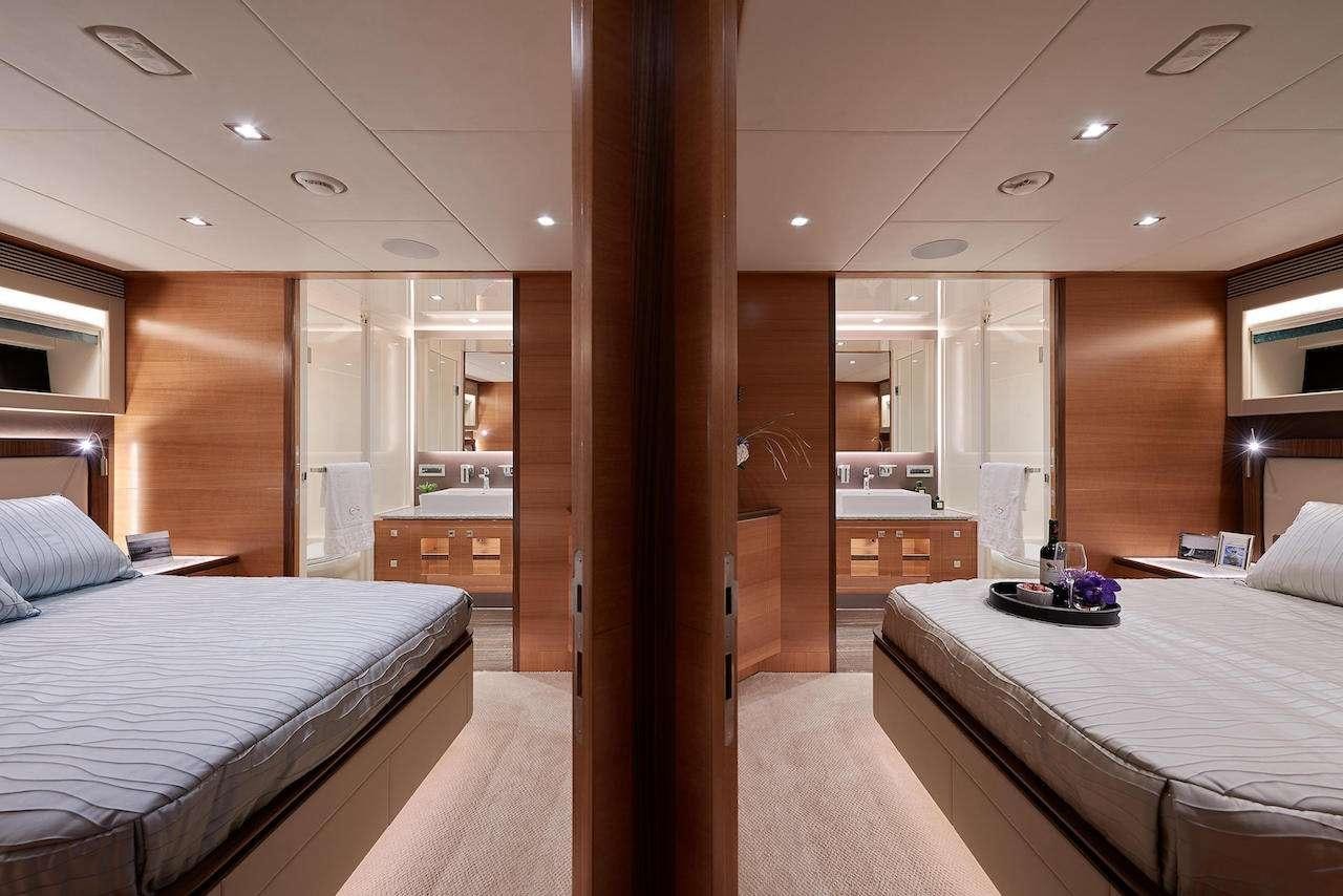 a room with a bed and a mirror aboard MIDNIGHT MOON Yacht for Charter