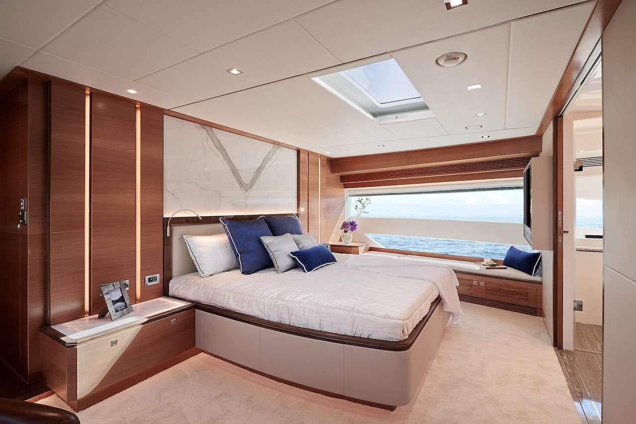 a room with a bed and a window aboard MIDNIGHT MOON Yacht for Charter