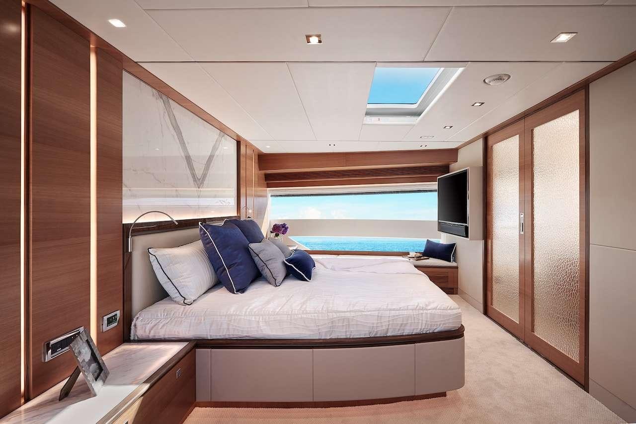 a person lying on a bed aboard MIDNIGHT MOON Yacht for Charter