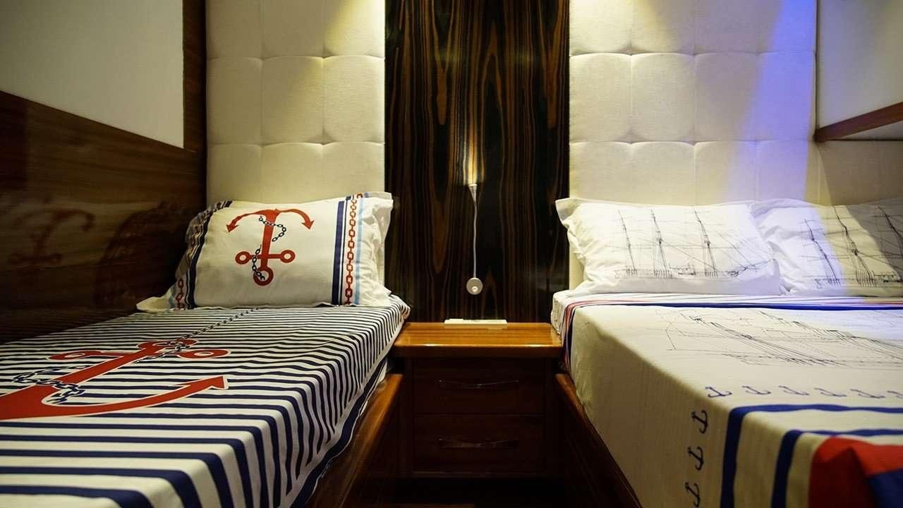 a couple of beds in a hotel room aboard SADIYE HANIM Yacht for Charter