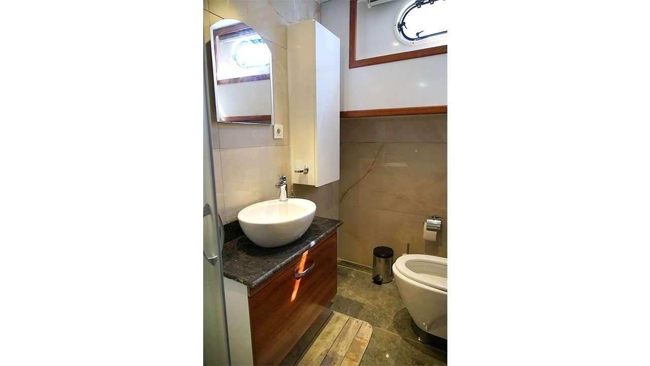 a bathroom with a sink and toilet aboard SADIYE HANIM Yacht for Charter