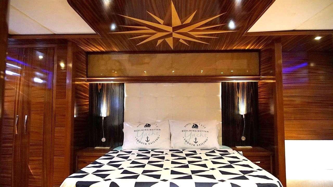 a bed with white sheets aboard SADIYE HANIM Yacht for Charter