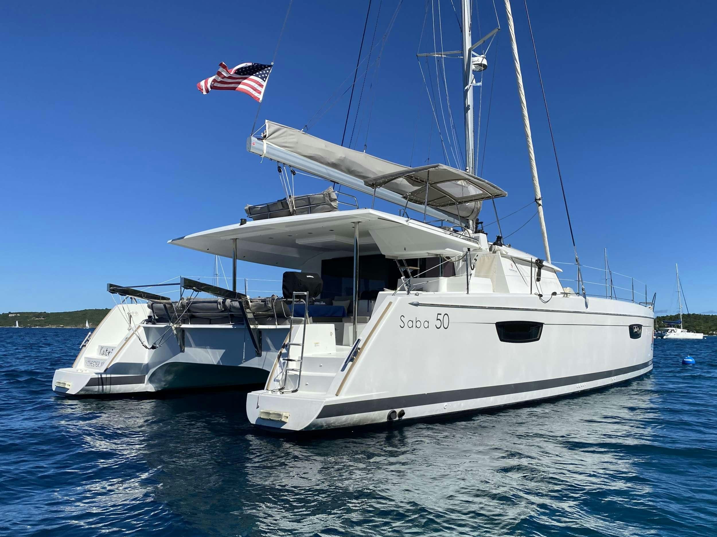a boat with a flag on the front aboard KATRINA Yacht for Charter
