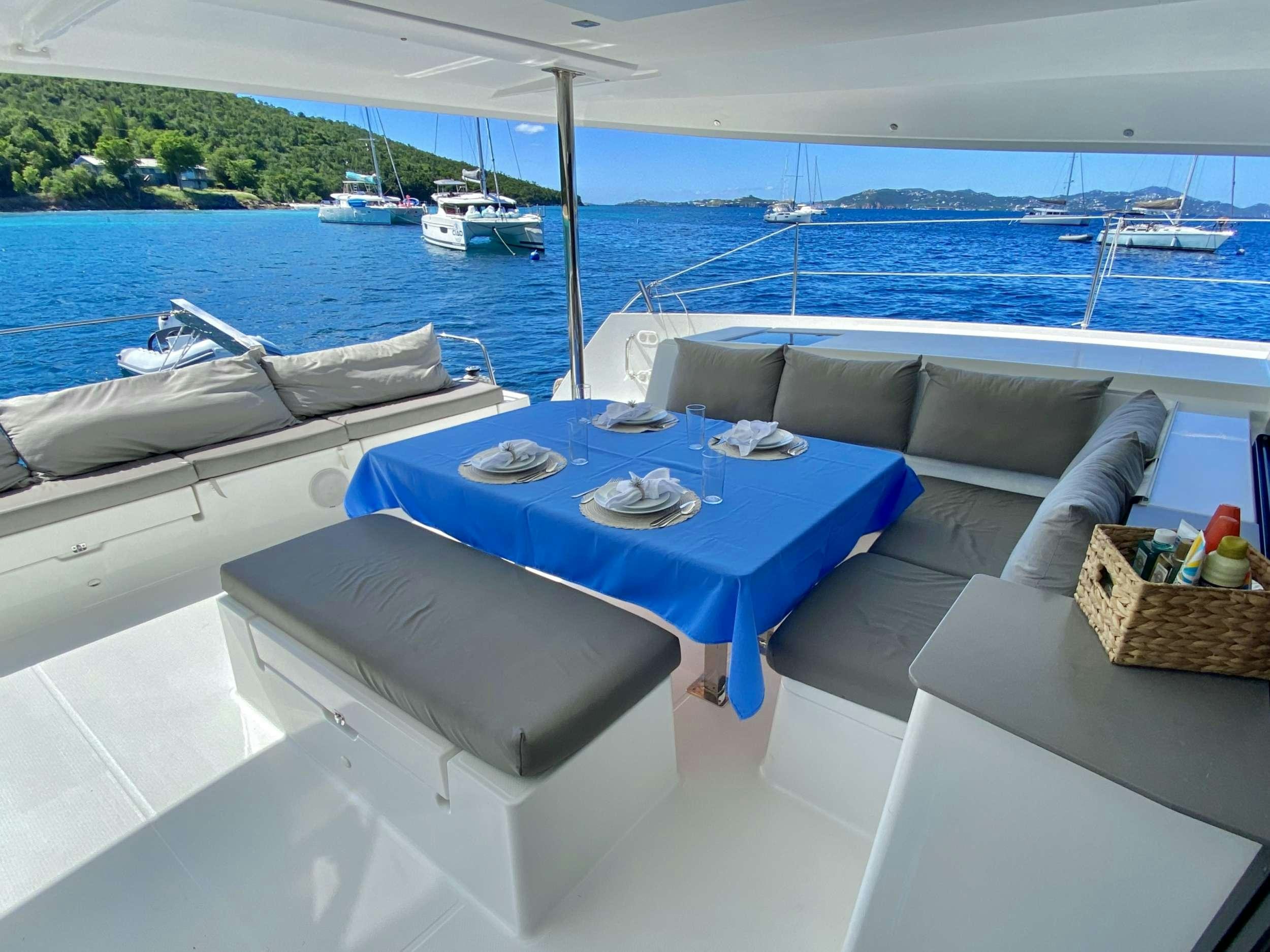a table and chairs on a boat aboard KATRINA Yacht for Charter
