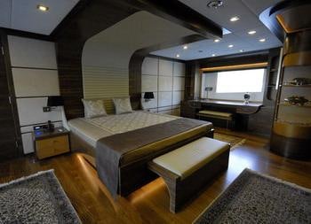 a bedroom with a bed aboard STEEL Yacht for Charter