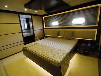 a bed in a room aboard STEEL Yacht for Charter