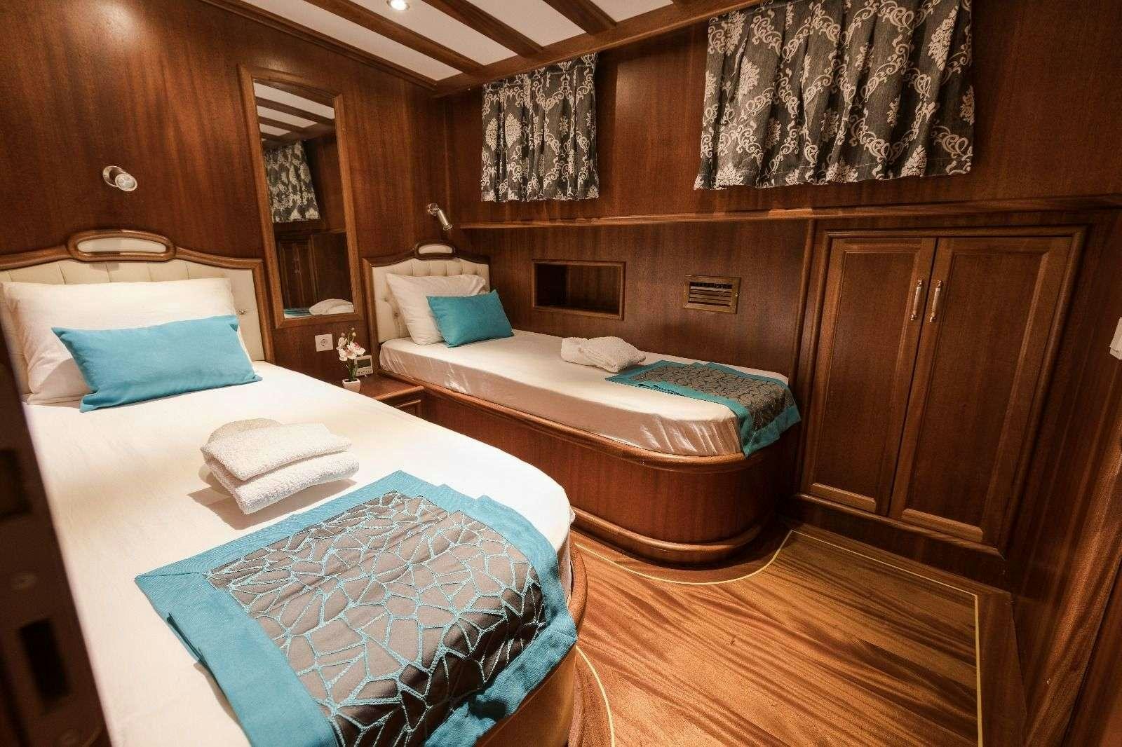 a room with two beds aboard KORAY EGE Yacht for Charter