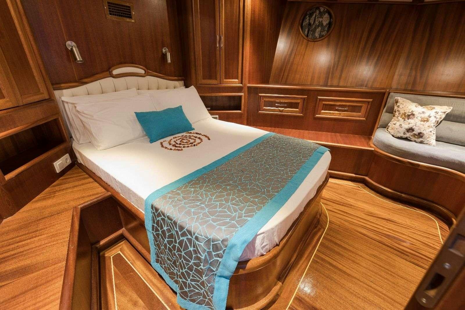 a bed in a room aboard KORAY EGE Yacht for Charter
